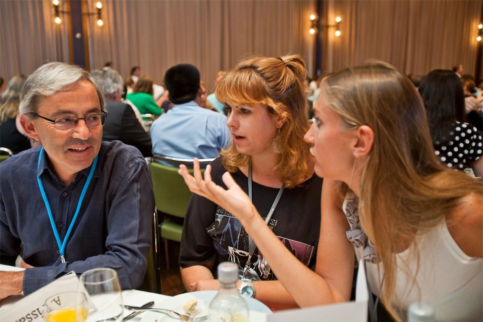 Nobel Laureate Christopher Pissarides with young researchers  