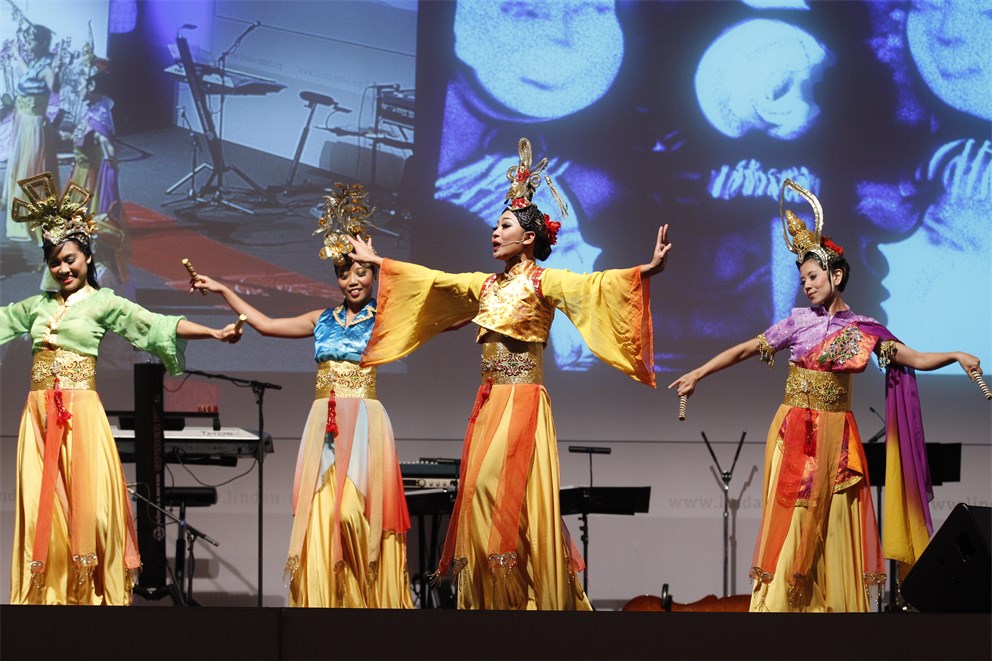 Singaporean women performing a traditional dance at the Singaporean evening