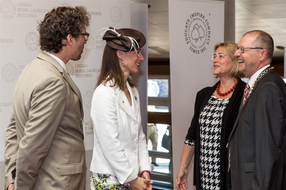 Countess Bettina Bernadotte welcomes mayor Gerhard Ecker and his wife at the 65th Lindau Nobel Laureate Meeting.