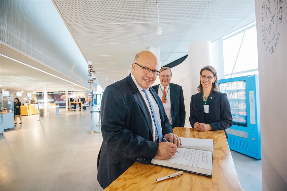 German Federal Minister Peter Altmaier signing the guest book