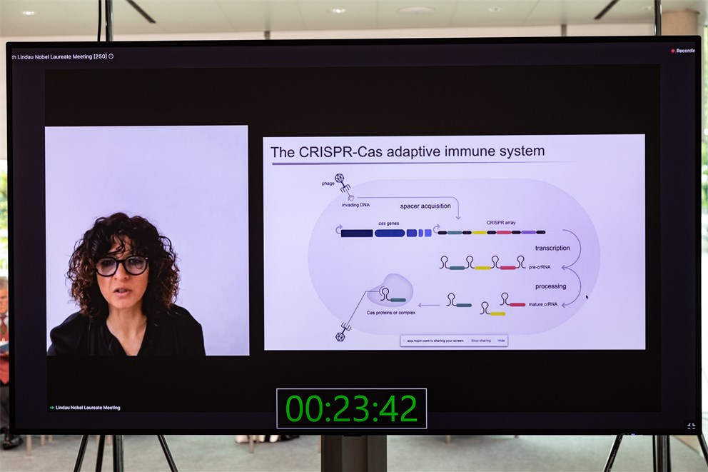 Emmanuelle Charpentier delivering her opening lecture "CRISPR-Cas9: Transforming Life Sciences With Bacteria".
