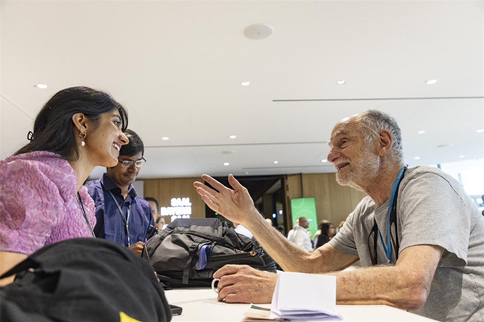 Michael Rosbash conversing with Young Scientists