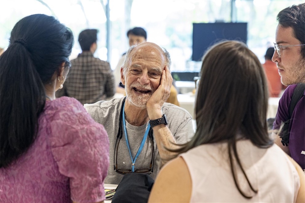 Michael Rosbash conversing with Young Scientists